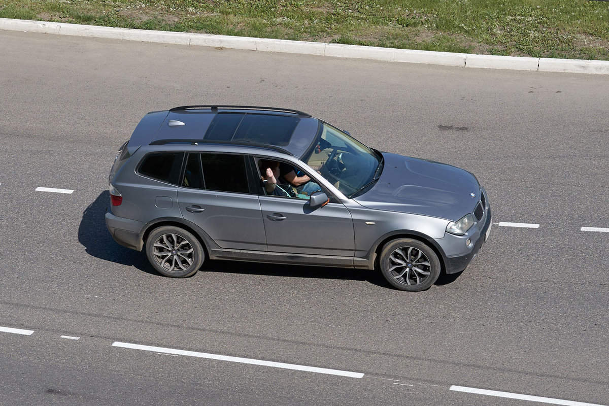 An aerial photo of a BMW X3 moving in the highway