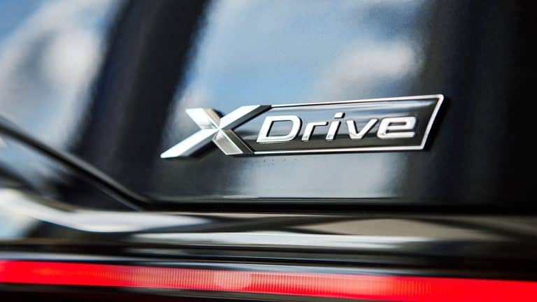 Xdrive emblem on the back of the car, Pros and Cons of BMW XDrive: A Comprehensive Guide - 1600x900