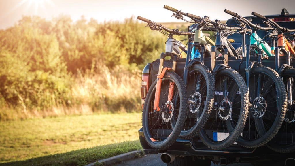 Bikes stacked on the back of a pickup truck, Tailgate Pad vs. Blanket Which is the Ultimate Accessory for Your Pickup Truck - 1600x900