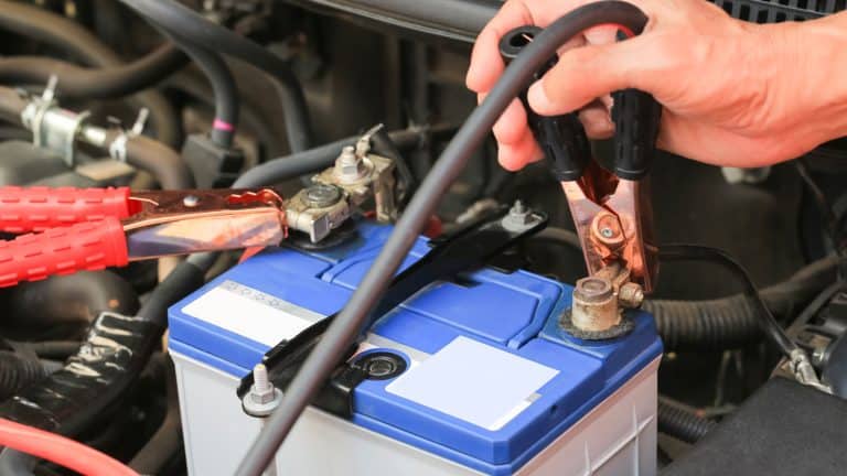 Mechanic placing alligator clips to the car battery, Cen Tech Battery Charger: A Step-By-Step Guide to Charging Your Batteries! - 1600x900