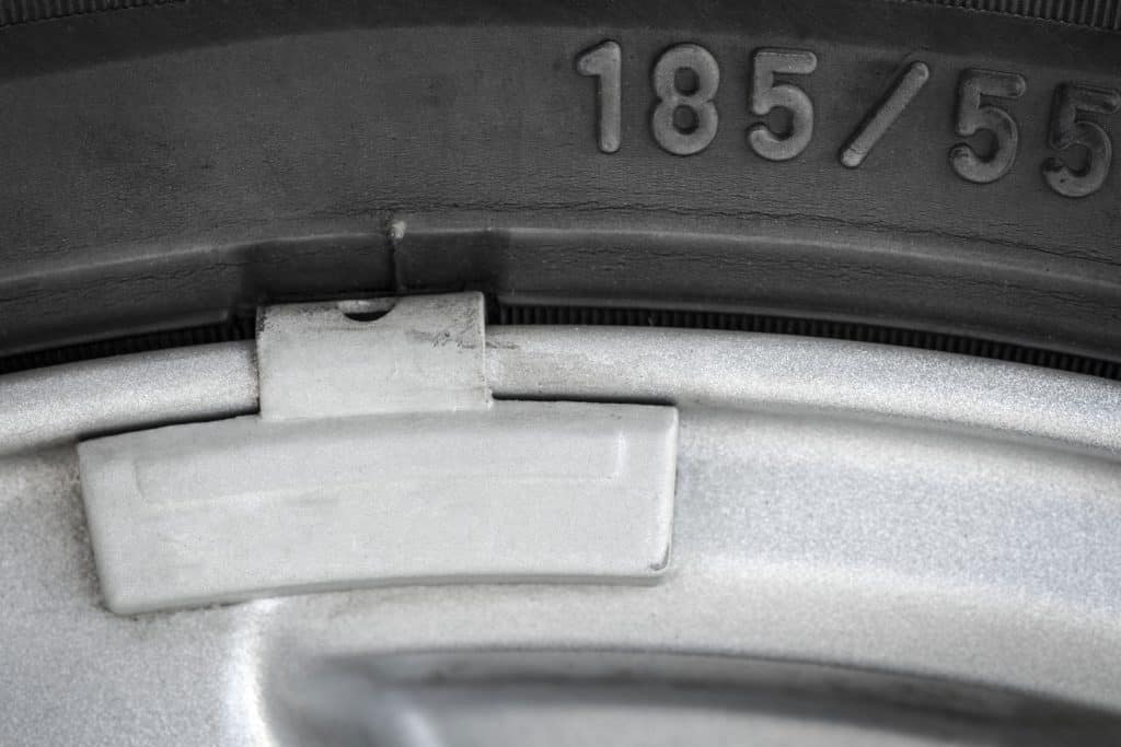 Up close photo of a tire balancer