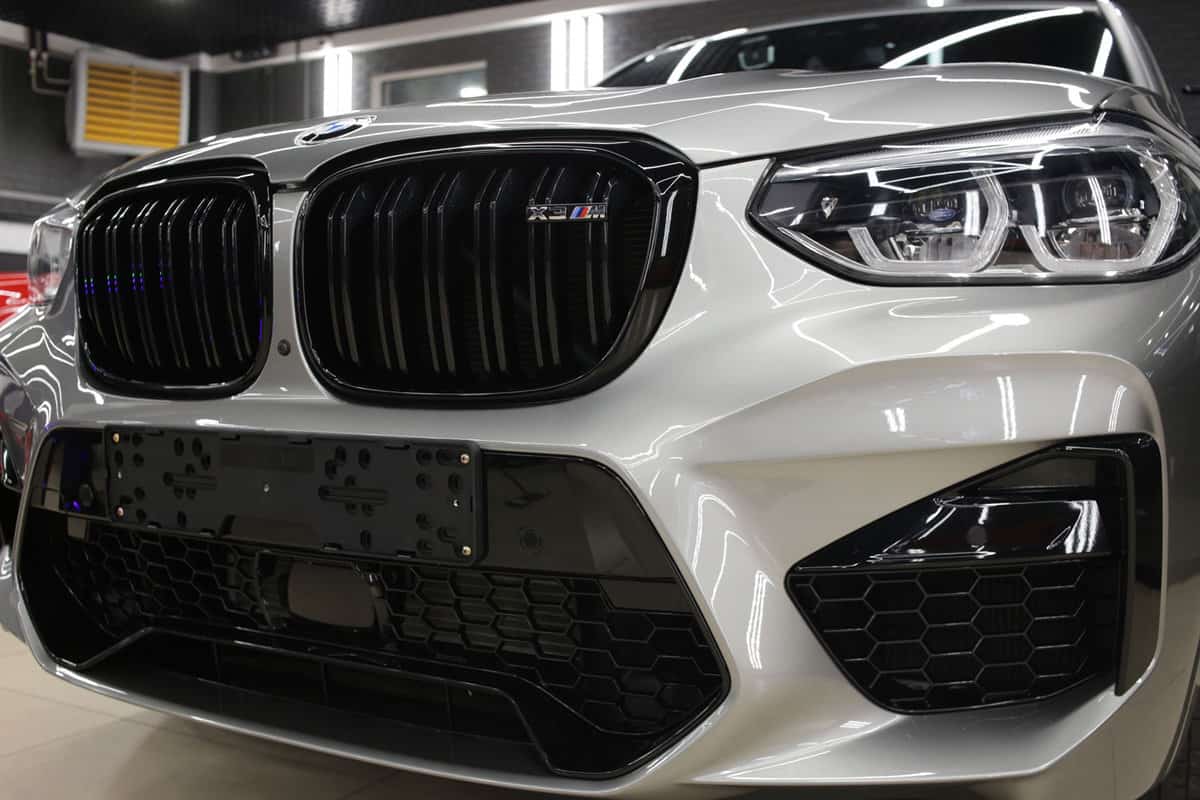 Bright white colored BMW X3 at a dealership