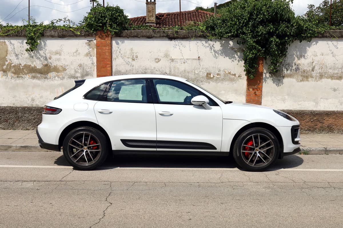 White Porsche Macan parked on the side of the road