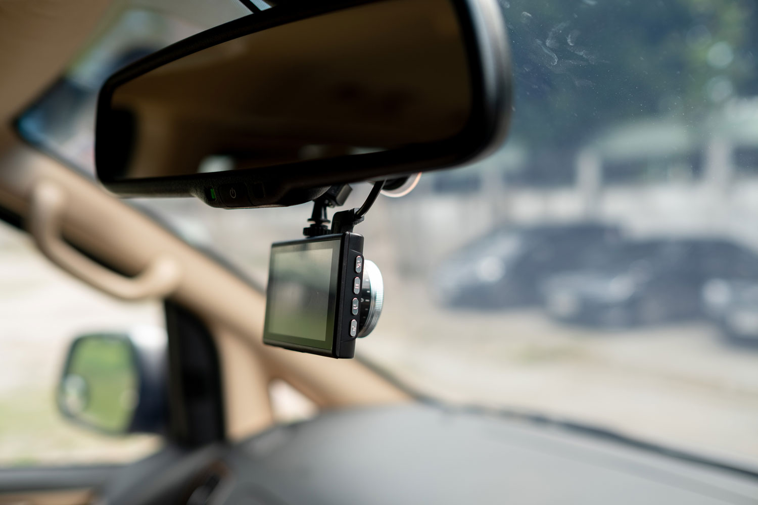 A dashcam installed in the rear view mirror